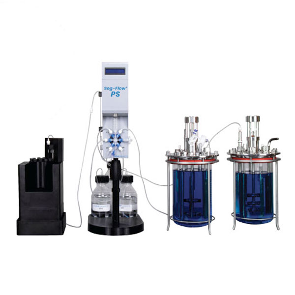 sample collector carousel connected to seg-flow ps and 2 glass bioreactors
